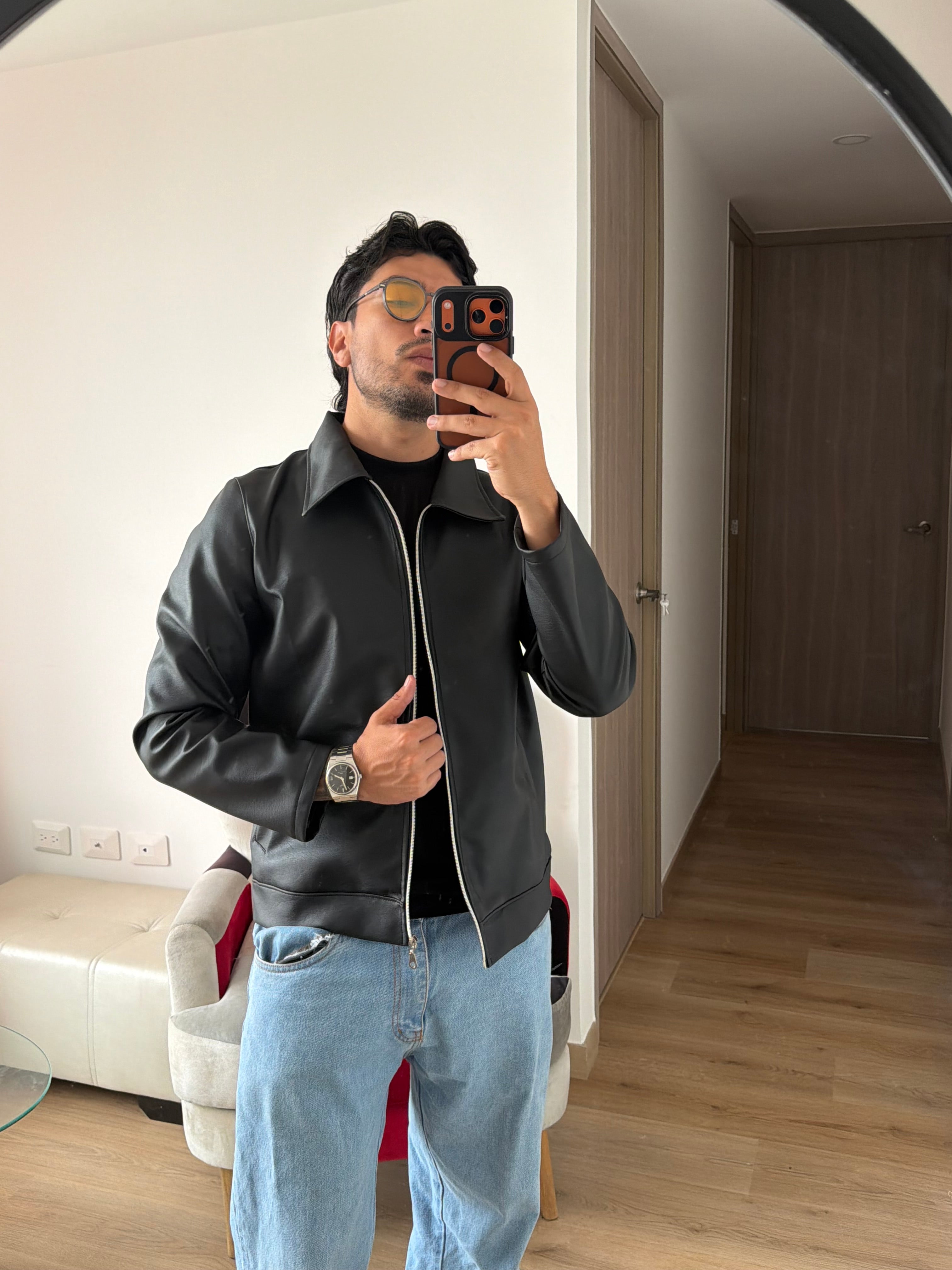 Chaqueta polo cuero text